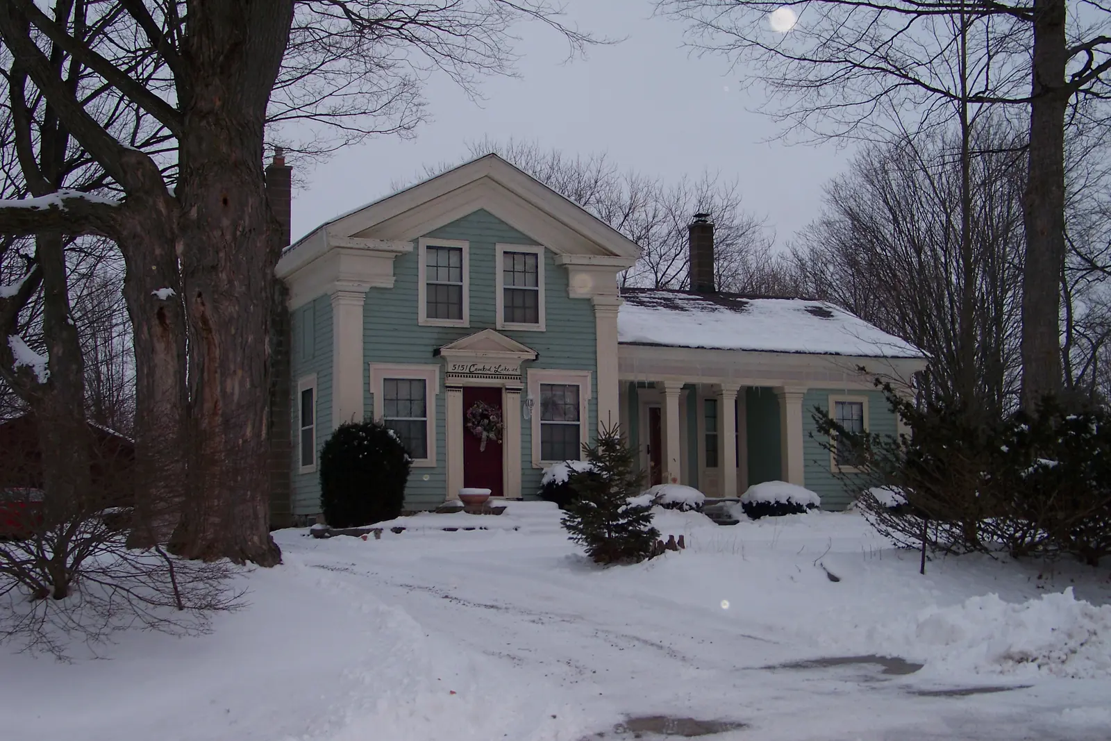 Older Michigan home in winter snow