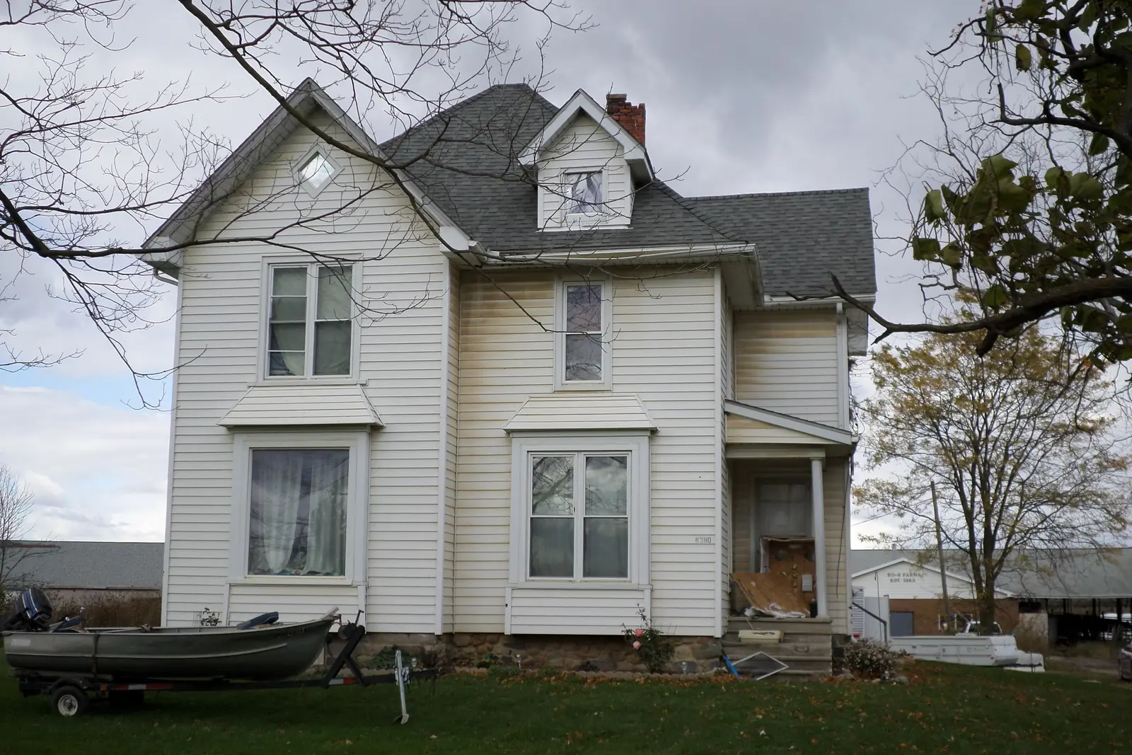 Two-story white farmhouse in Michigan