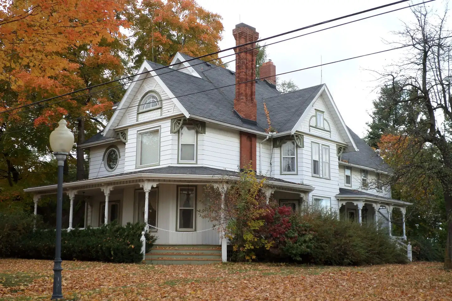 Victorian home with autumn trees in Grand Blanc, Michigan